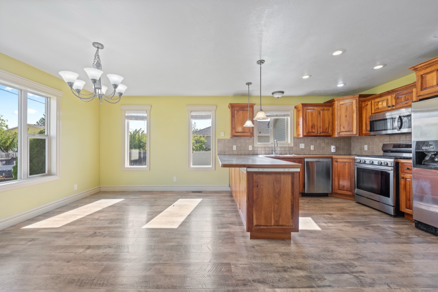 Kitchen with stainless steel appliances and dining area